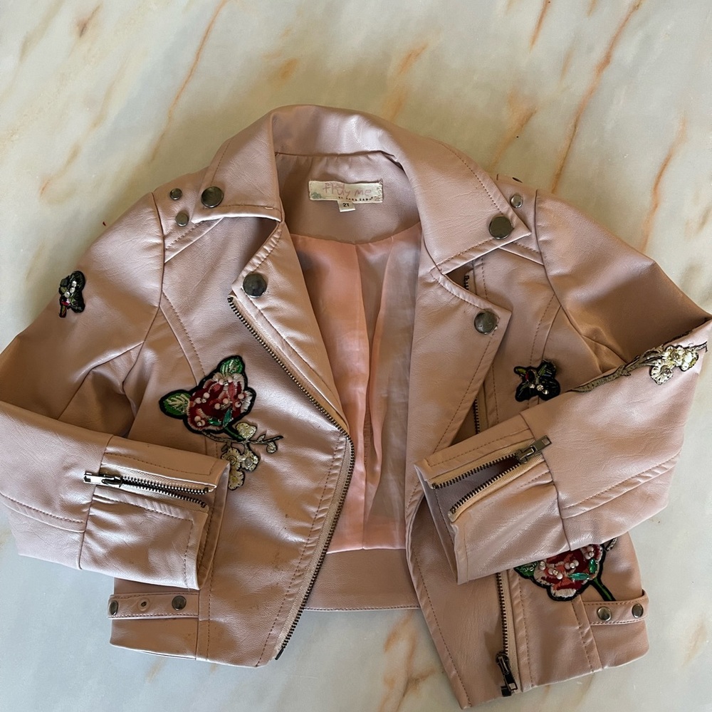 blush leather jacket with floral appliqués